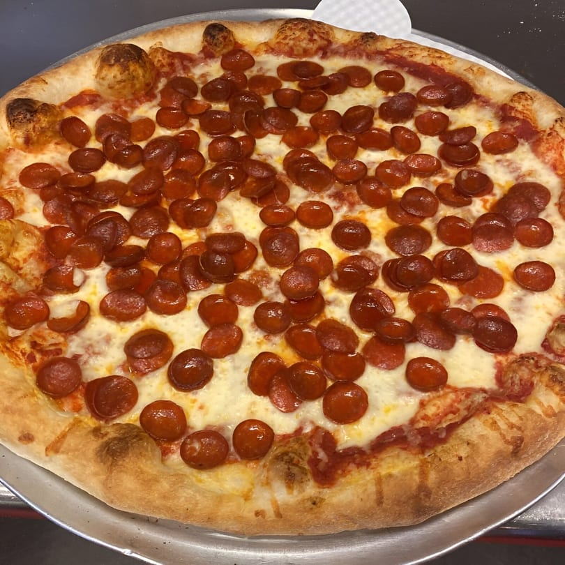 A freshly baked Biaggio Pizzeria pepperoni pizza with melted cheese and a golden crust.